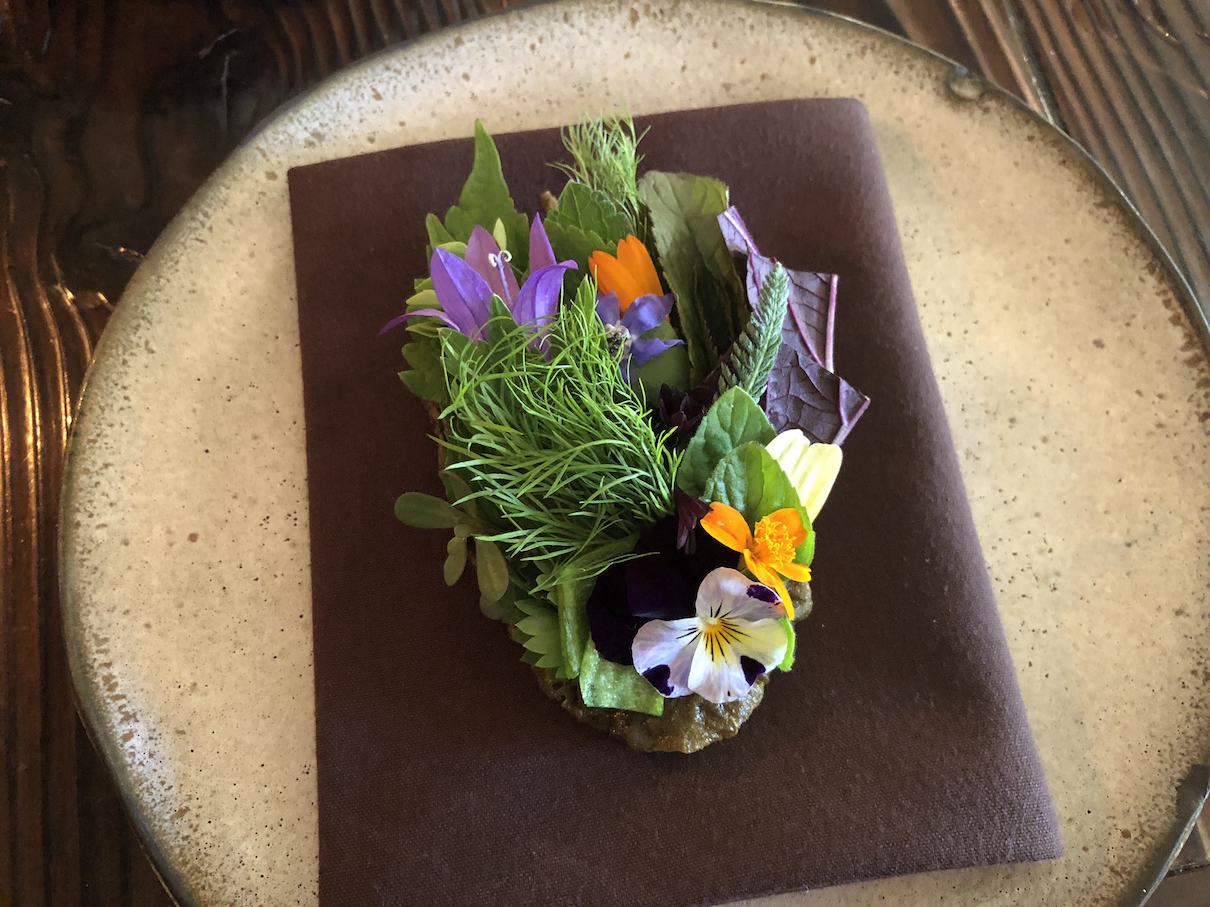 Flowers on a toasted something at The Willows Inn